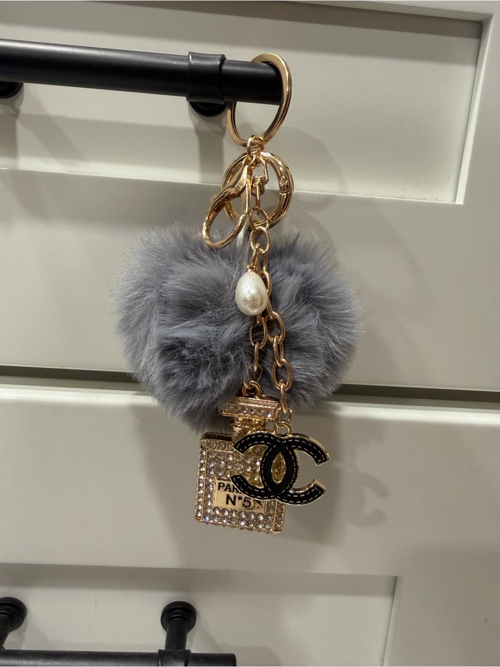 Gray Faux Fur Pom Keychain with Gold & Black Chanel Charm